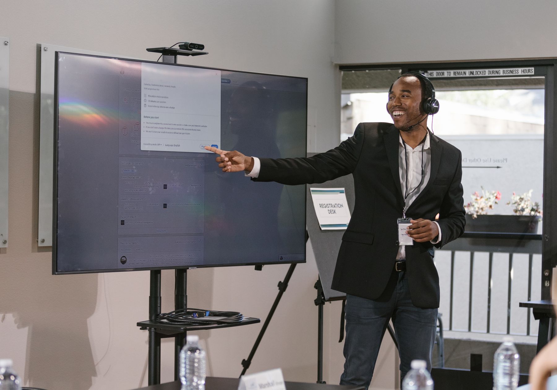 A speaker presenting technology at a professional event