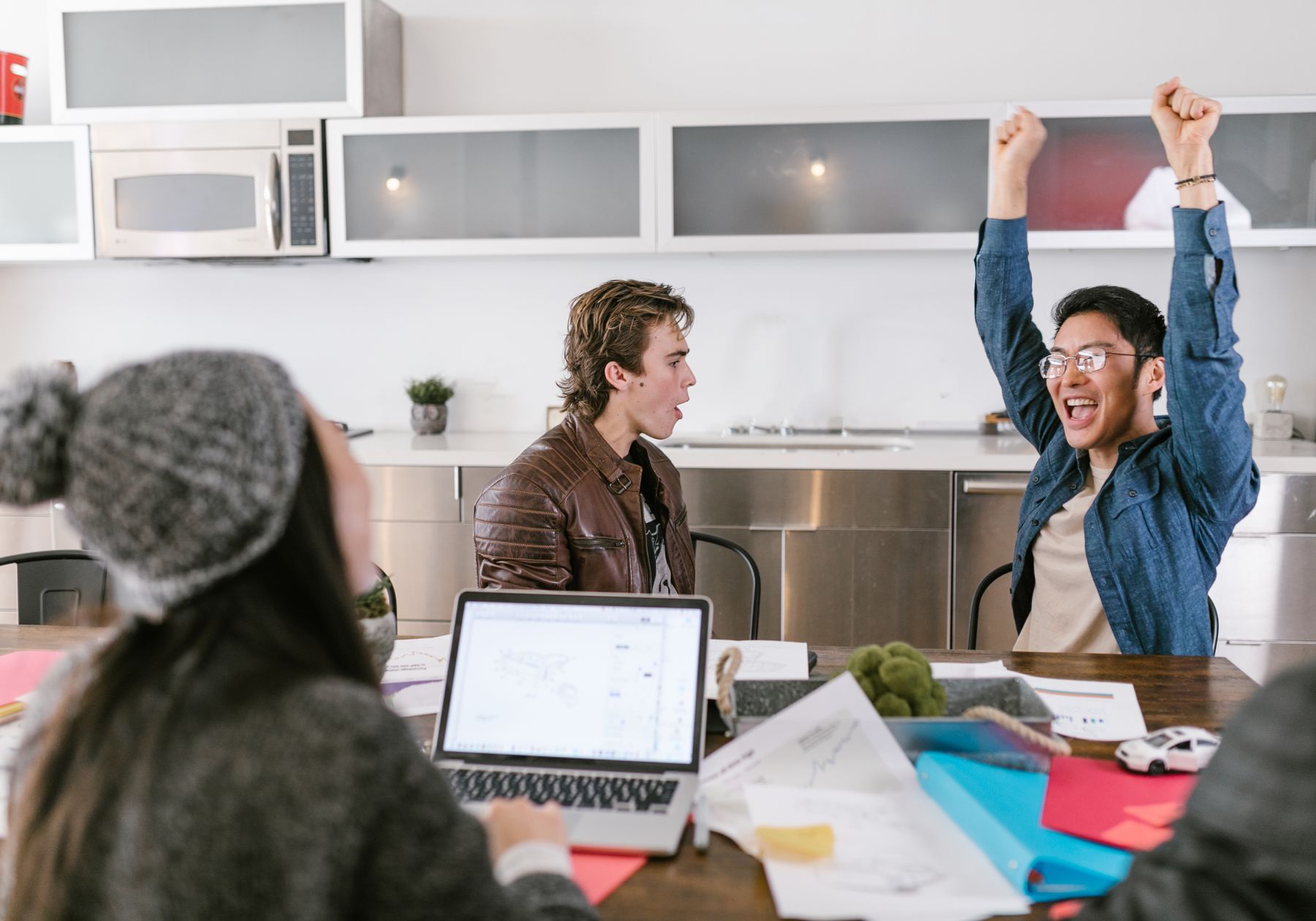 A start-up team celebrating a shared success