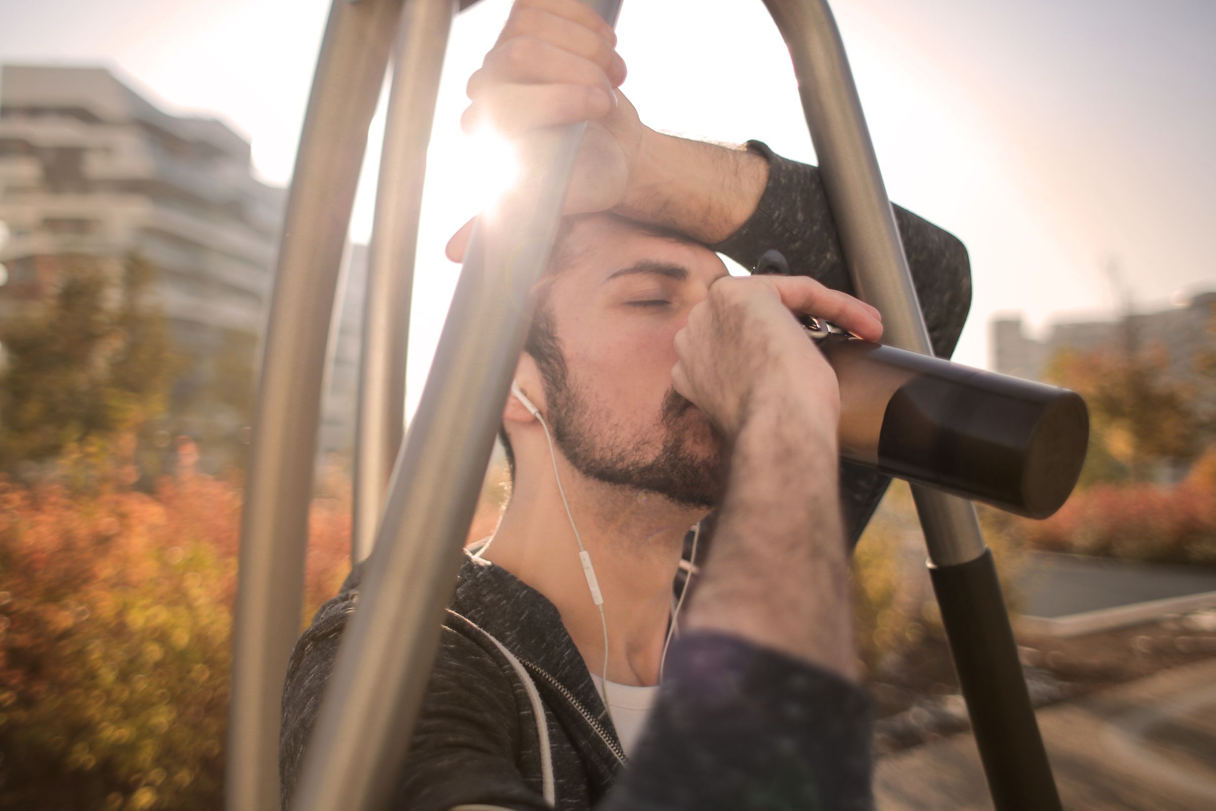 Runner taking a water break after outdoor exercise