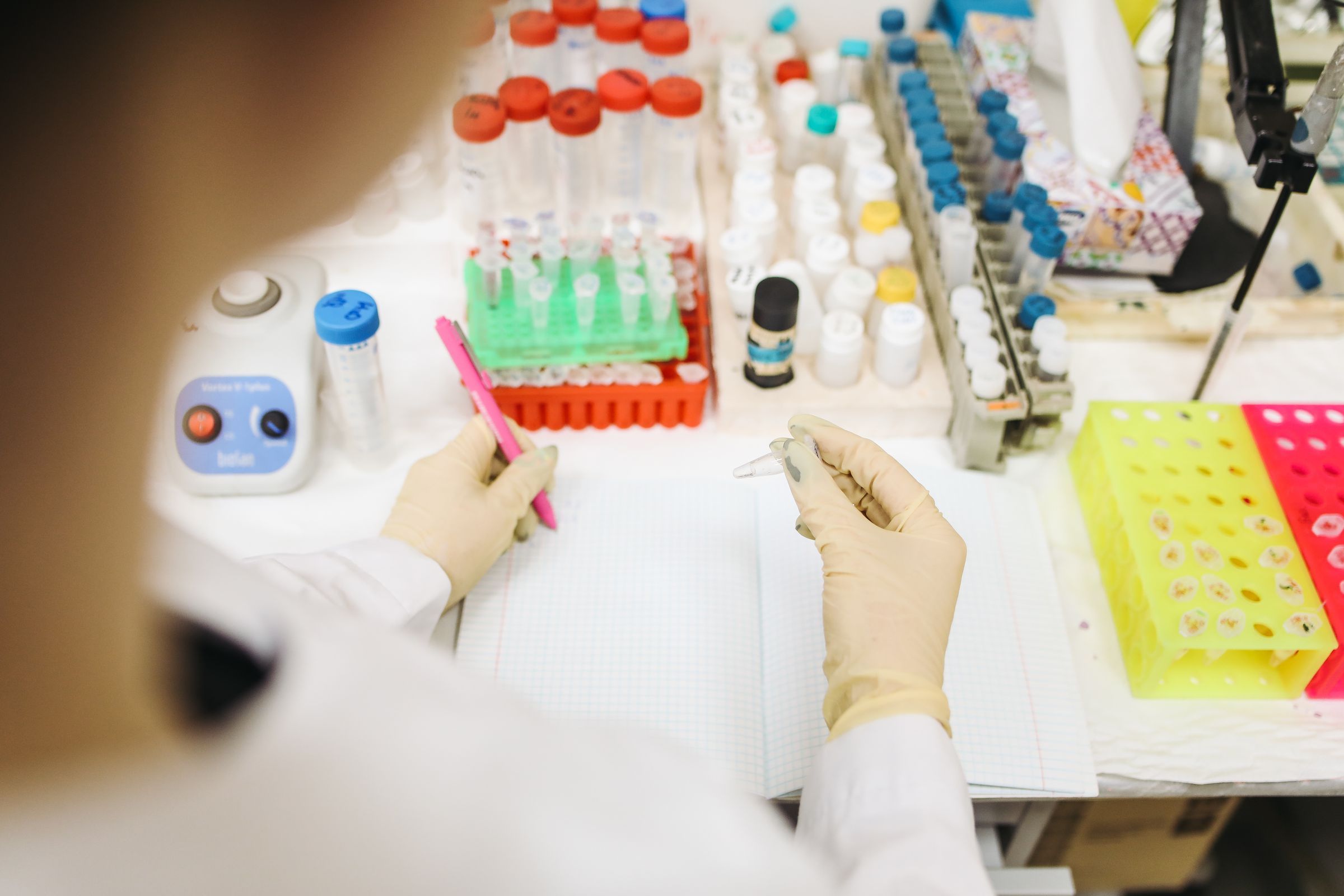 A laboratory researcher documenting a sample test