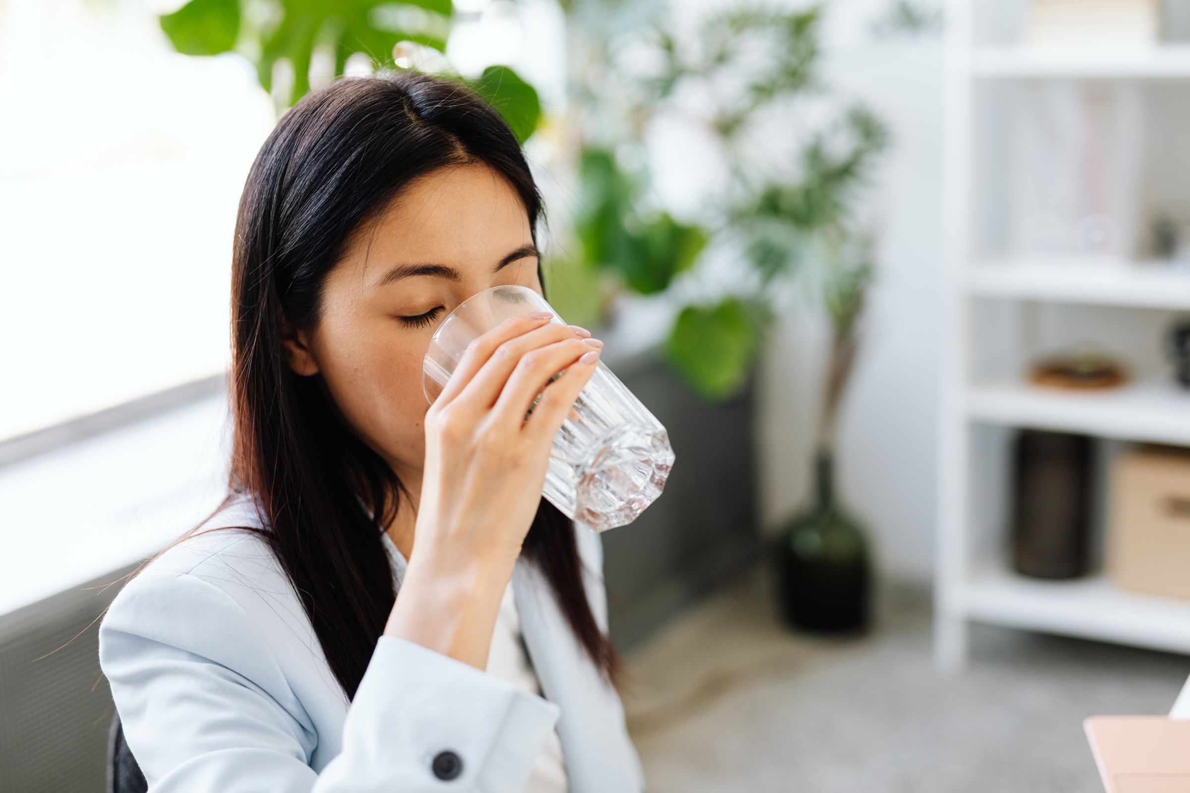Professional enjoying a glass of water during the day